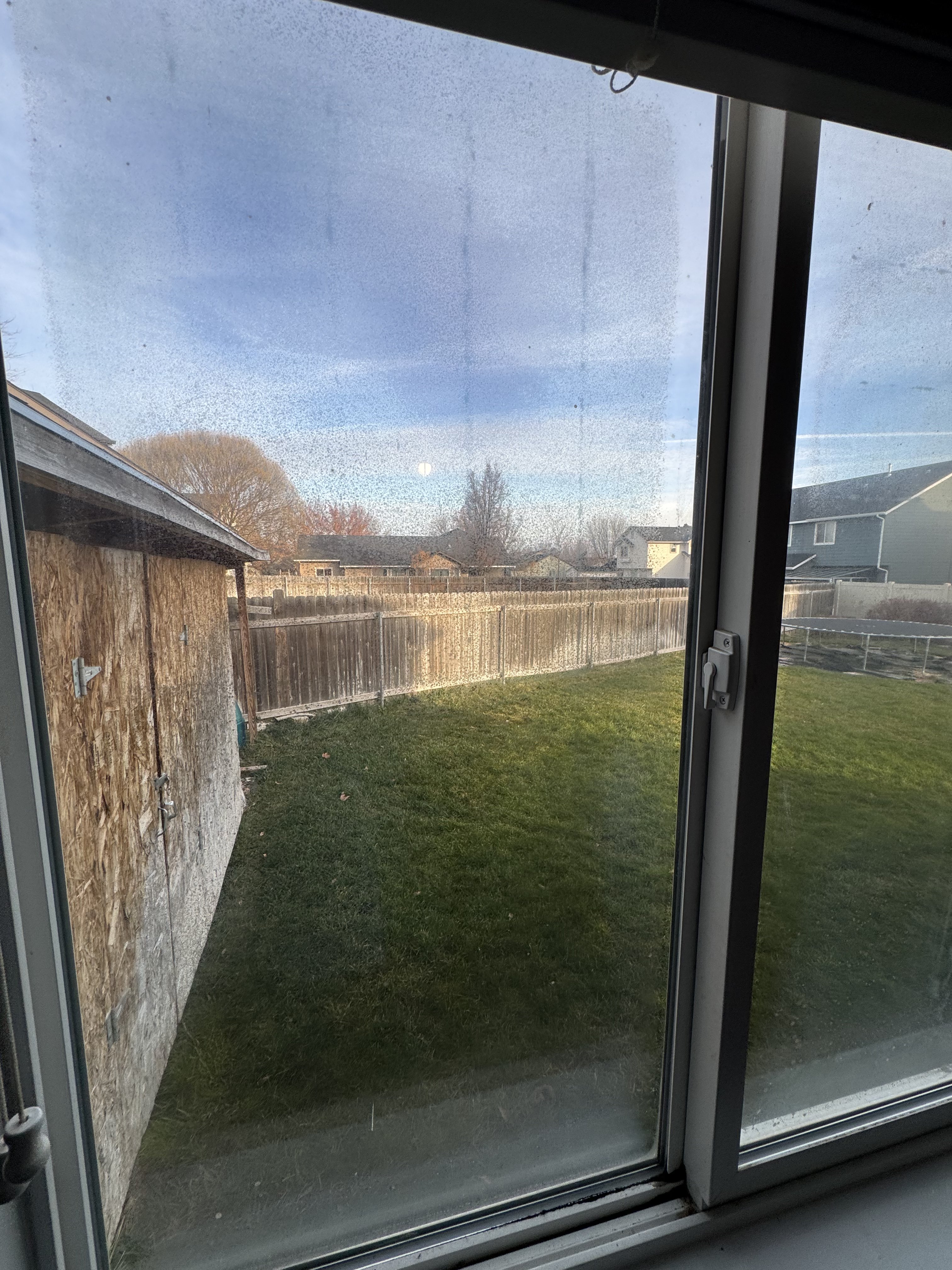 Failed window seal showing vertical moisture streaks